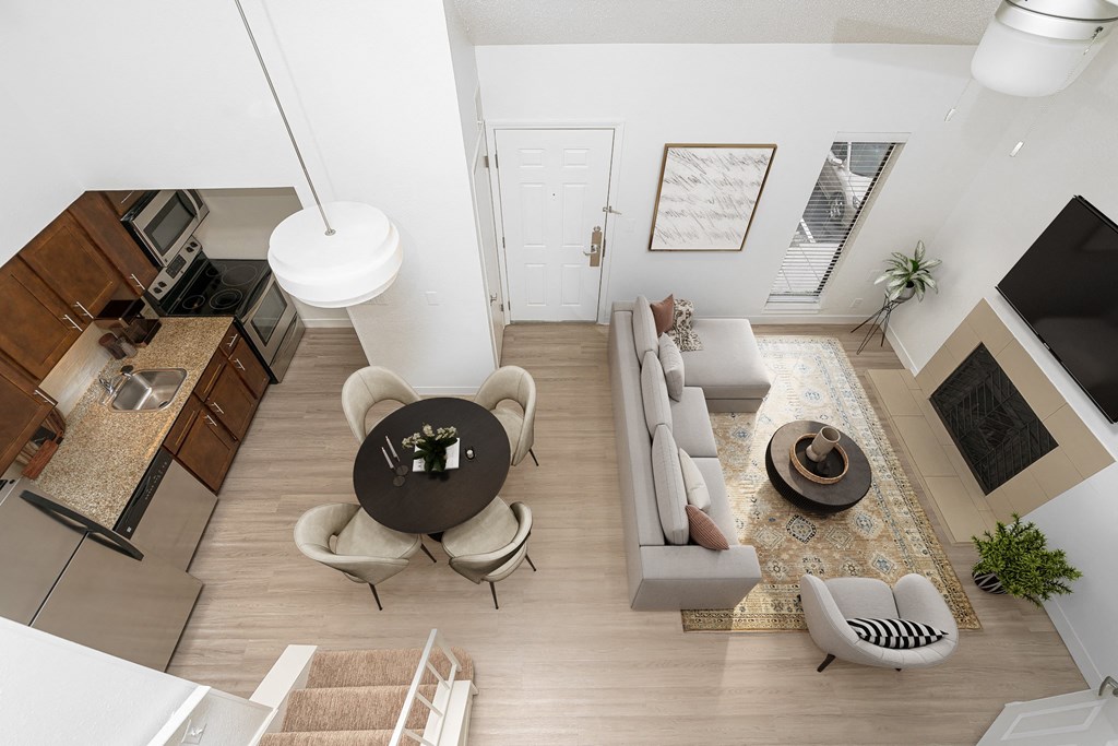 an aerial view of a living room and dining room from above